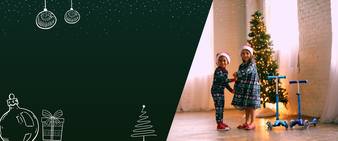 to børn i julenattøj med o blå micro løbehjul